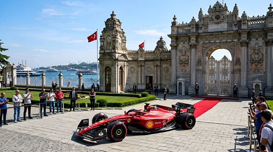 Red Formula 1 car on a red carpet outside a grand ornate gate, Turkish flags fluttering by the water.